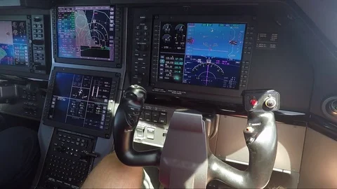 Private airplane cockpit - closeup of modern avionics (screen and joystick) Stock Footage