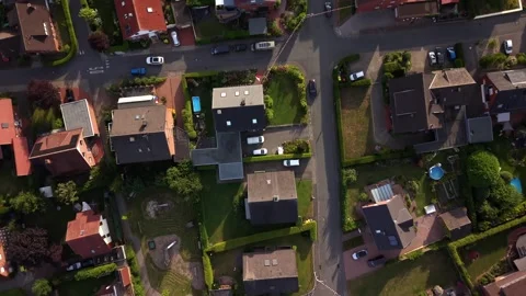 Private backyard pools dot dense suburban German neighborhood at golden sunset Stock Footage 340921976