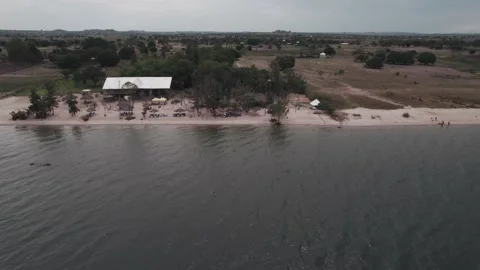 Private beach bar located next to Lake Victoria Stock Footage 230080215