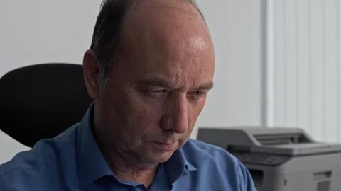 Private entrepreneur with a centered face at work in an office in a cubicle Stock Footage 261288232