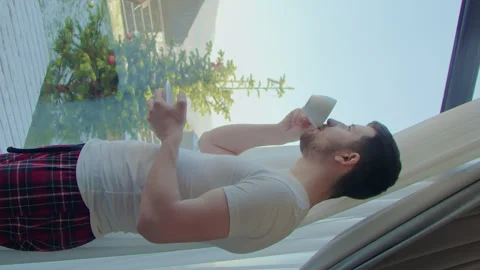 Private house man look through panoramic window vertical video. Look through Stock Footage 265015247