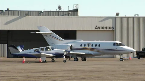 Private Jet and Plane Outside Avionics Hangar Stock Footage 42765840