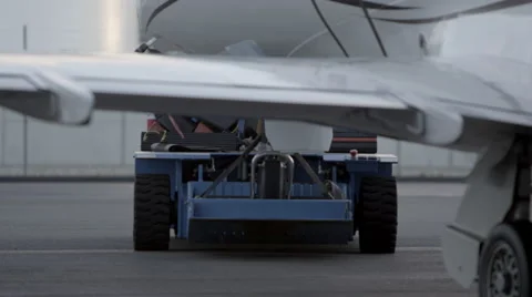 Private Jet being towed to runway Stock Footage 55692672
