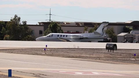 Private jet driving up to runway Stock Footage 221378058