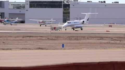 Private jet driving up to runway at palomar airport Stock Footage 221378059