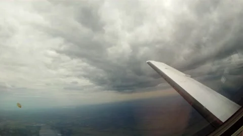Private Jet flying under the clouds Stock Footage 64276203