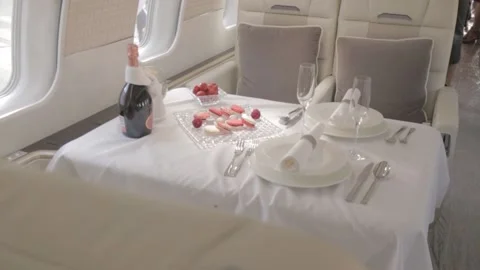 Private jet interior with laid table Vídeos de archivo 221766327