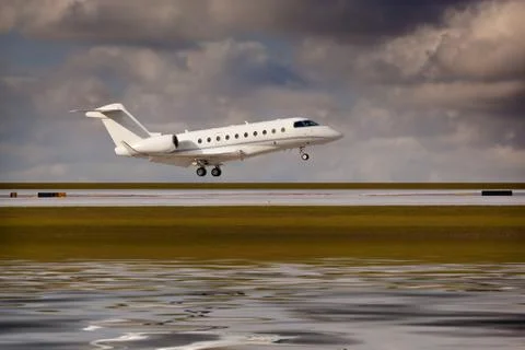Private jet landing Stock Photos