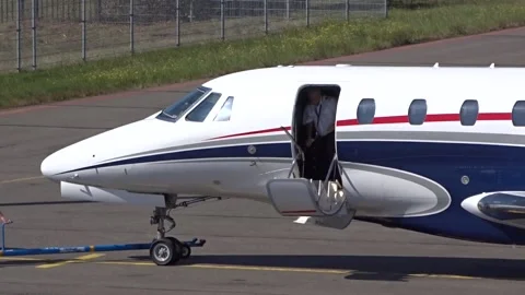 Private Jet opening the door at Small Airport Stock Footage 237856986