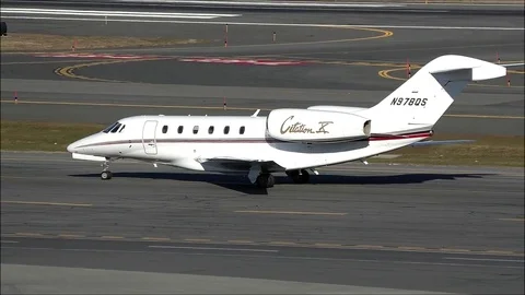 Private jet plane Citation taxies runway Stock Footage