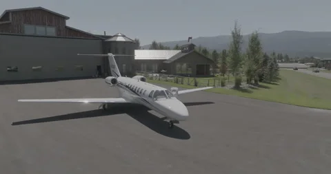 Private Jet Plane in front of Hanger Home Stock Footage 221155811
