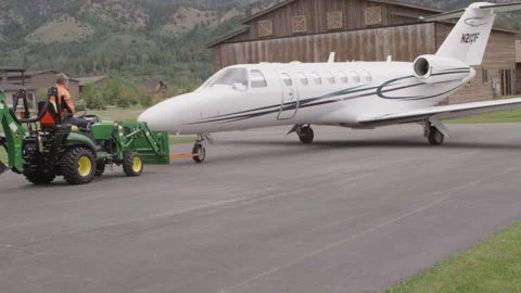 Private Jet Plane Tractor Tug 2 - 3840 x 2160 Stock Footage 221451983