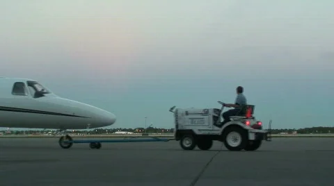 Private jet is pulled through frame Stock Footage 112610