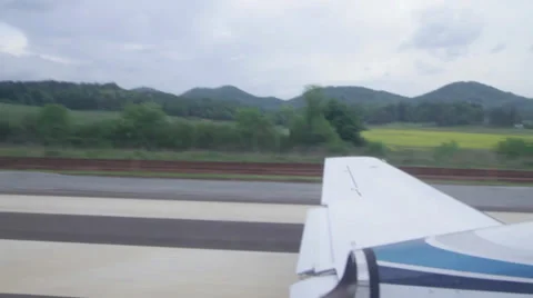 Private Jet Taking off the runway in the mountains Stock Footage 38523787
