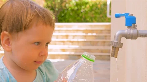 Private kindergarten background. Water problems on earth. Preschooler playing on Stock Footage 113271738