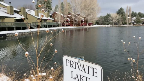 Private Lake with Sign and Townhouses Stock Footage