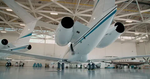 Private Lear Jet Parked in Airplane Hanger Stock Footage 168745188