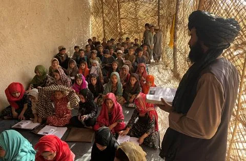 Private organization opens primary classes for children in Afghan villages, Kand Stock Photos