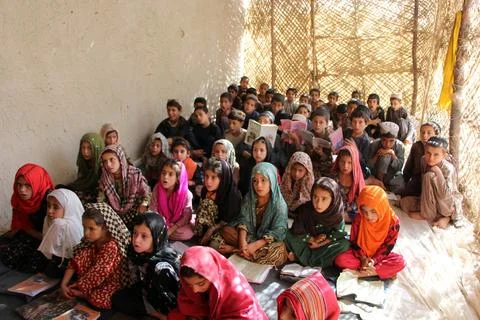 Private organization opens primary classes for children in Afghan villages, Kand Stock Photos