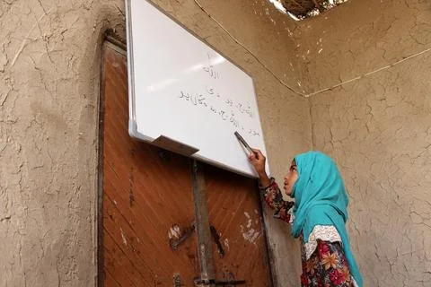 Private organization opens primary classes for children in Afghan villages, Kand Stock Photos