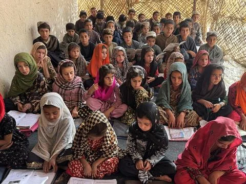 Private organization opens primary classes for children in Afghan villages, Kand Stock Photos