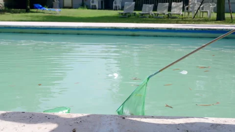 Private pool is dirty with different trash like dry leaves, paper wastes Video stock 302449400