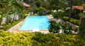 Private Pool next to Tropical Island Villa. Picturesque Green Landscape. Speed HD Footage