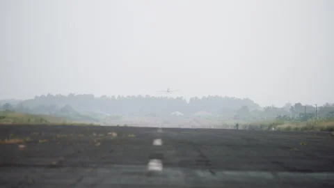 Private propeller plane lands on the runway in Cameroon, Africa Stock Footage 261975779