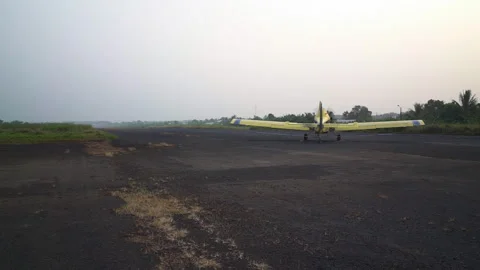 A private propeller plane moves along the runway in Limbe, Cameroon, Africa Stock Footage 261957987