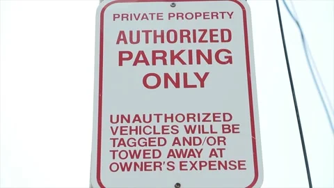 Private property authorized parking only unauthorized vehicles will be tagged Vídeo Stock 248247946