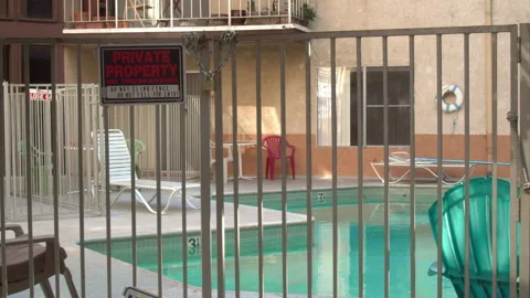 Private Property - Closed Empty Pool With Lifeguard Raft Stock Footage 130773825