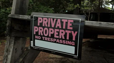 Private Property No Tresspassing Sign in breeze Stock Footage