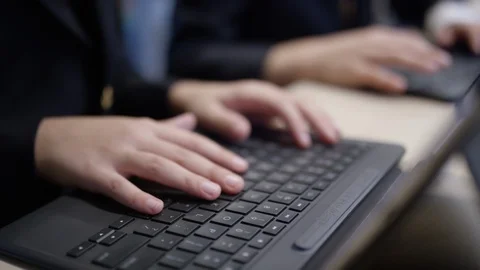 Private school kids on computers learning high tech Stock Footage 98905976