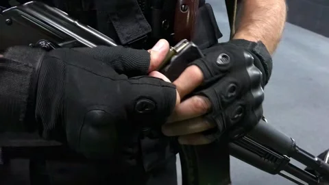 Private Security Loading an AK-47 Stock Footage 315031579