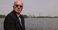 Private Service Agent in Black Suit Wearing Sunglasses in Surveillance Mission 4k or 4k+ Resolution