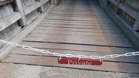 Private sign blocks access on Arundel Castle bridge, pan down from gatehouse Stock Footage 342114428