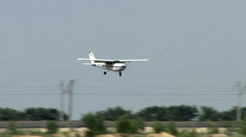 Private small Plane landing at a Local Airport Stock Footage 51591950