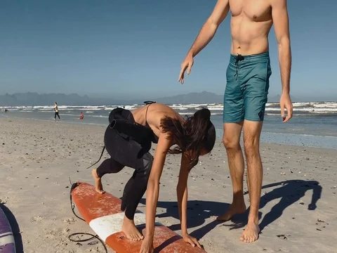 Private surf lesson on beach 스톡 동영상 76520886