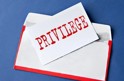 PRIVILEGE - word on a white sheet lying on an envelope on a blue background Stock Photos