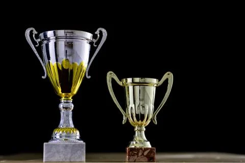 Prize, a cup standing on the table. Cup award on a black background. 写真素材