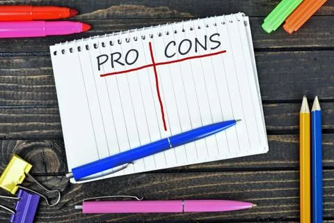 Pro and Cons text on notepad Stock Photos