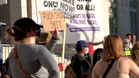 Pro Choice Protestor Holds up Sign "Fuck this Shit" in front of City Hall in LA Stock Footage 198472939