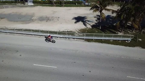 Pro cyclist in Key Biscayne, Florida Rickenbacker Causeway Stock Footage 102135280