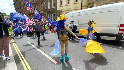 Pro-EU supporters with signs and flags at the National Rejoin March in London. Stock Footage 338387433