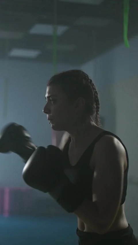 Pro fighter beats and trains his punches, hard training day in the boxing gym Stock Footage 329093393