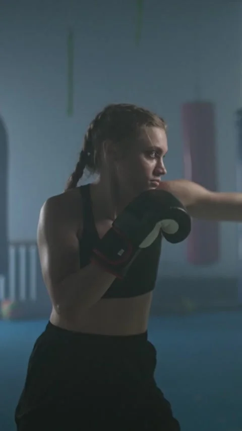 Pro fighter beats and trains his punches, hard training day in the boxing gym Stock Footage 329106042