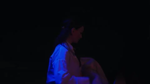 Pro figure skater taking off a jacket with Georgia on it and go out of the frame Stock Footage 253563887