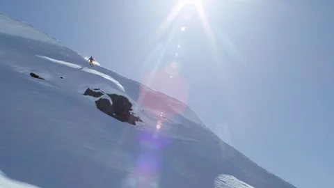 Pro freerider skiing down in slow motion, Tordrillo Mountain, Alaska Stock Footage 129119148