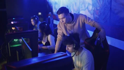 Pro Gamers trainer Explains Strategy to his apprentice Video stock 136412841