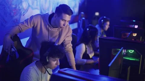 Pro Gamers trainer Explains Strategy to his apprentice Video stock 136748777